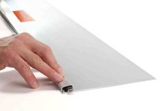 Fingers  holding down cover on EDGE-CUTTER