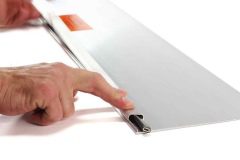 Fingers holding down cover on EDGE-CUTTER
