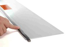 Middle finger on hand holding down heating cable on EDGE-CUTTER