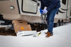 Contractor holding self-regulating low voltage heat trace system to install in RV