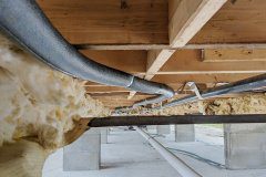 Insulated heat trace in an open crawlspace