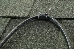 Paladin for Roof clipped onto green shingled roof